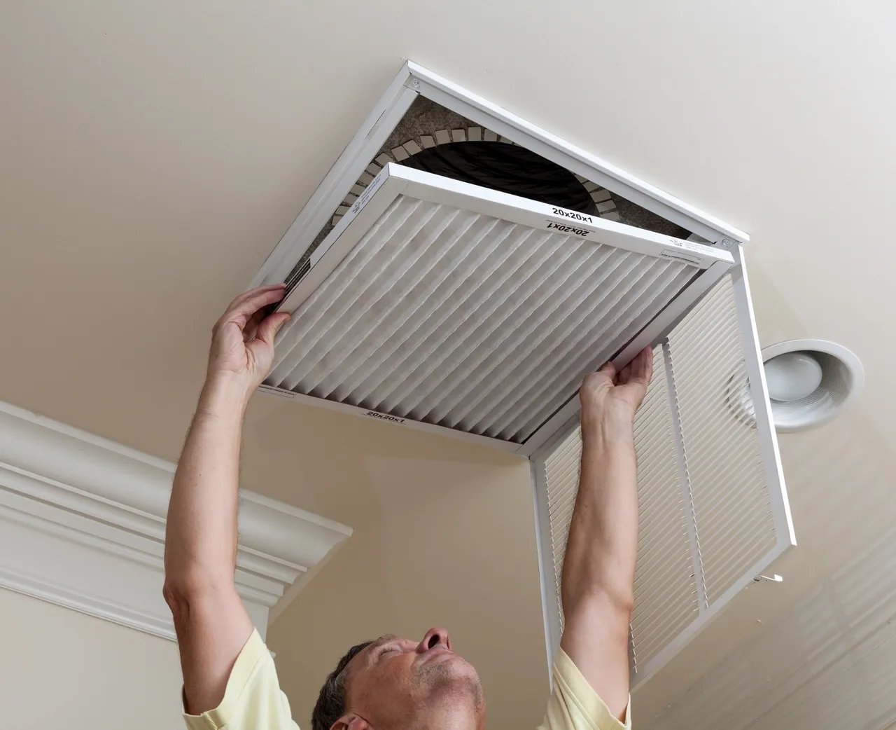 spring-home-maintenance Image shows the changing of air filters.